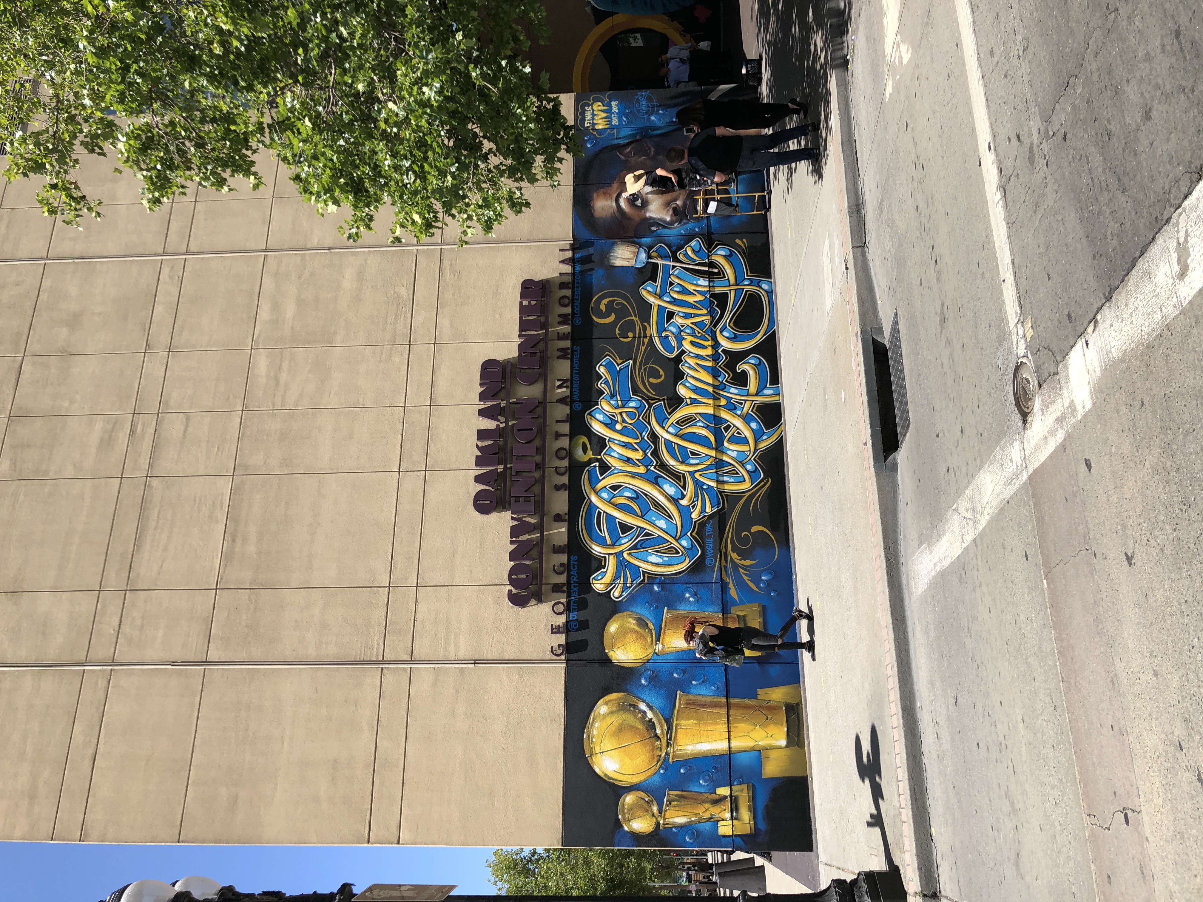 A large mural reading "Dubs Dynasty" decorates the exterior wall of the